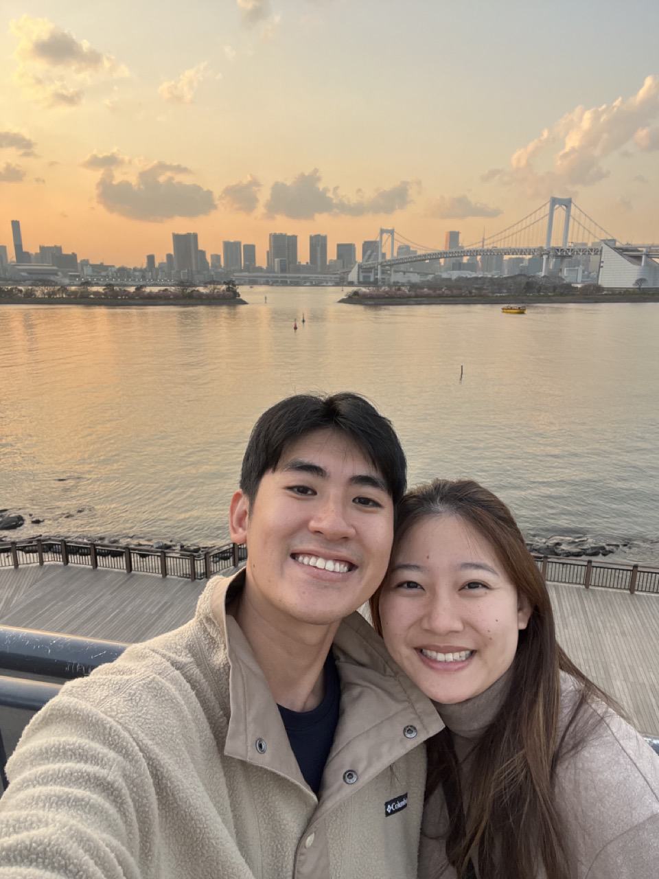 Selfie on the Odaiba waterfront with Rainbow Bridge behind us, near Hilton Tokyo Odaiba