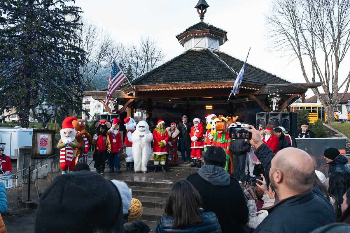 Christmas mascots and costumed characters performing at the downtown Leavenworth gazebo