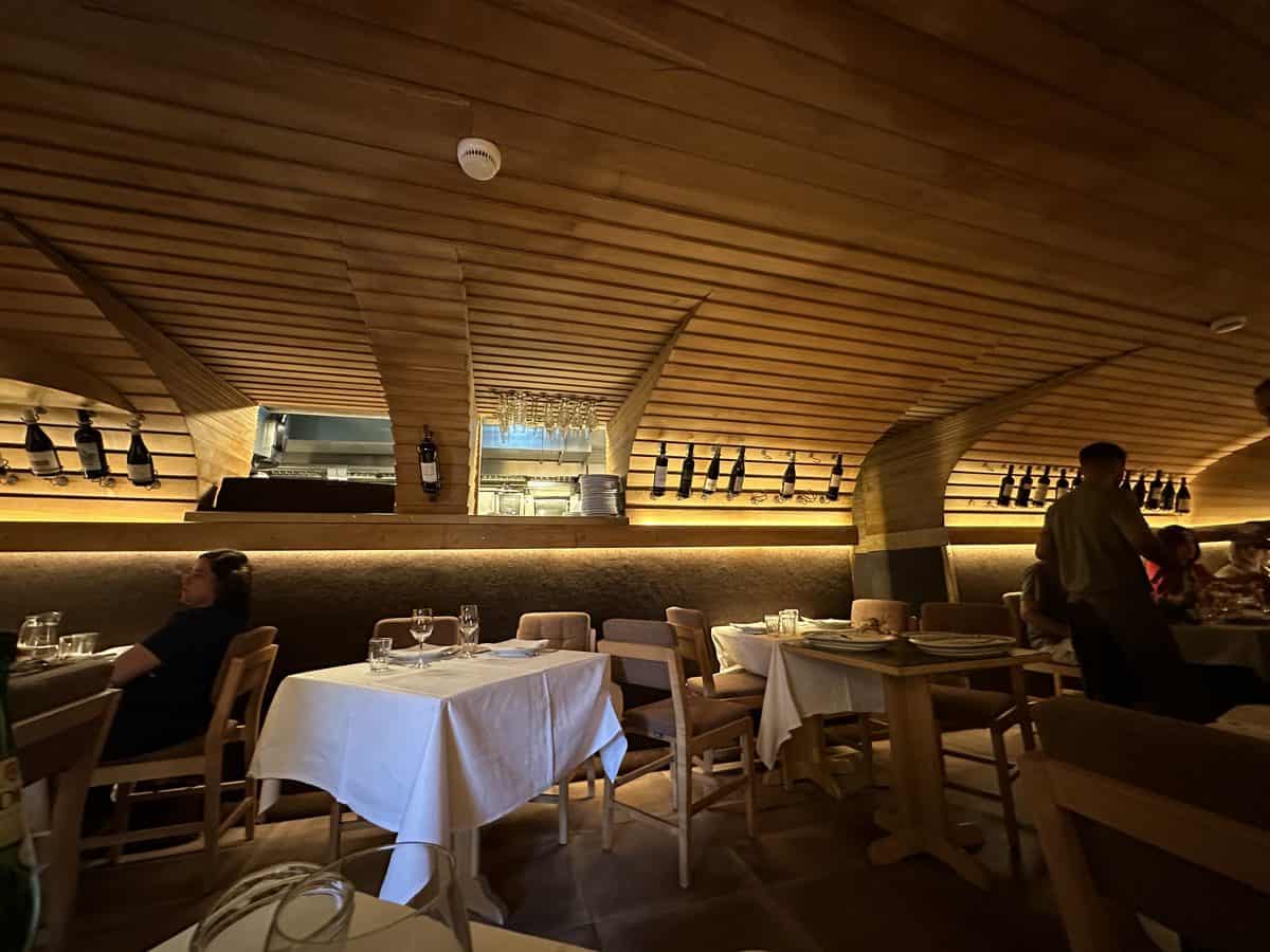 Barrel-vaulted wooden dining room at Adega Sao Nicolau in Ribeira