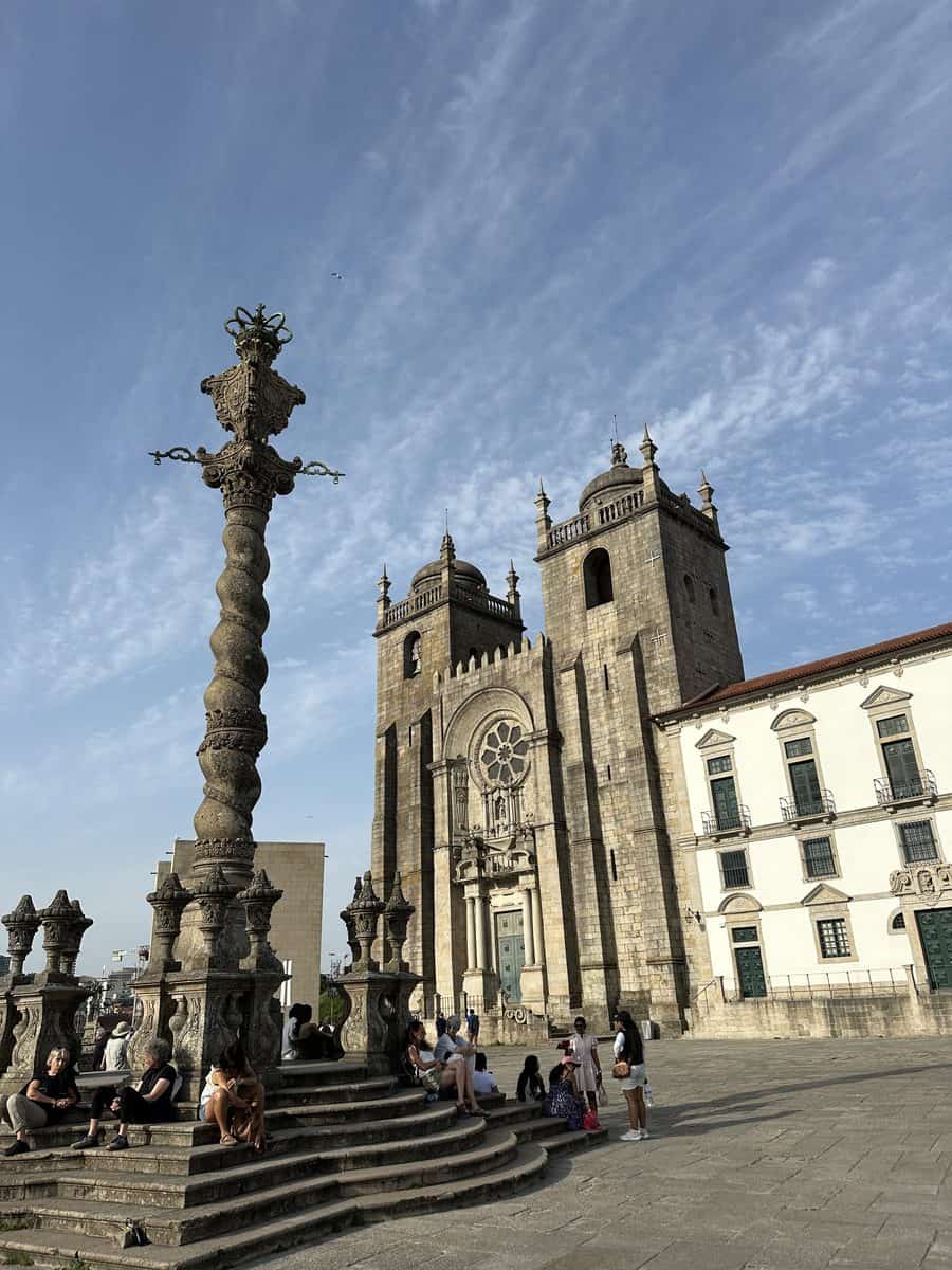Porto Cathedral facade beside the twisted stone pillory column